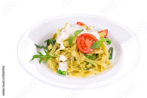 Italian pasta with pesto and herbs.