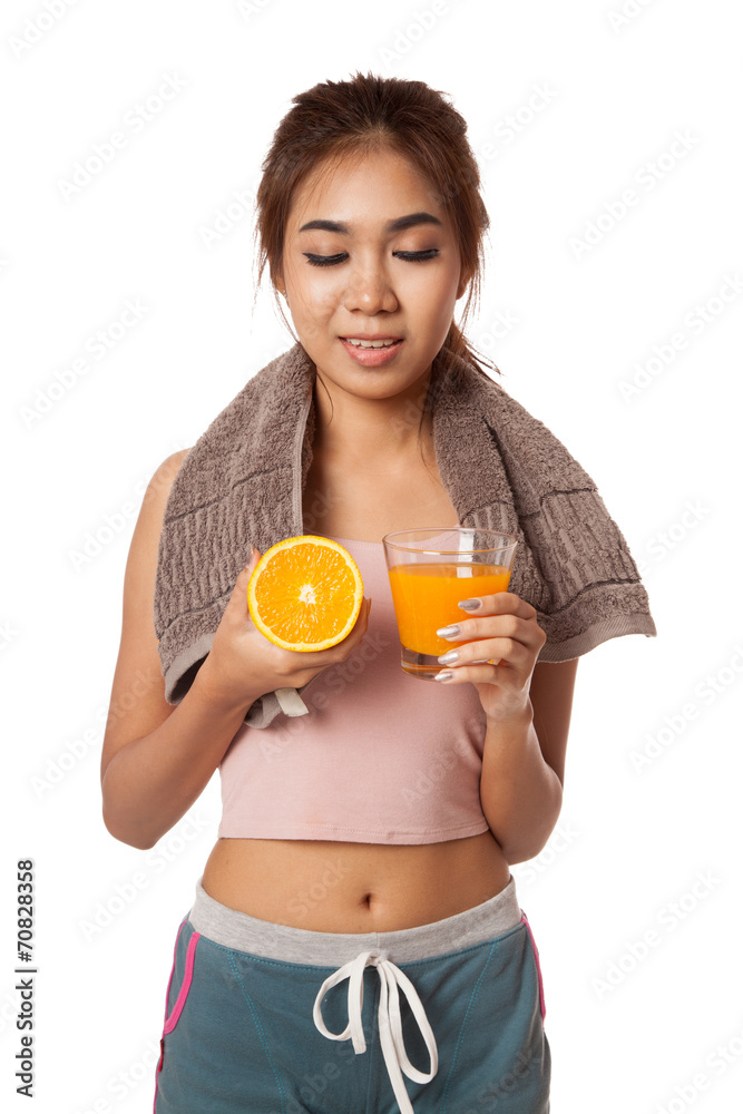 Asian healthy girl look at orange and orange juice Asian healthy girl look at orange and orange juice