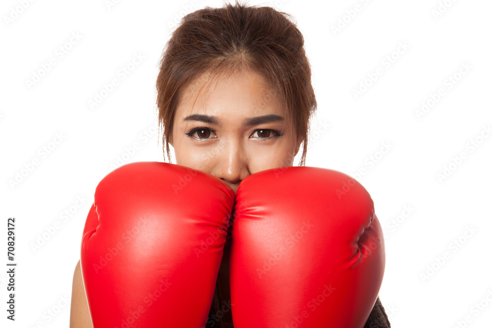 Asian slim girl guard with red boxing glove Asian slim girl guard with red boxing glove
