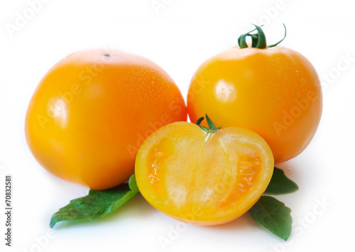 Yellow  persimmon tomatoes  isolated on white. 
