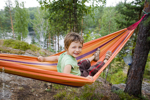 little cute boy in hammock smiling