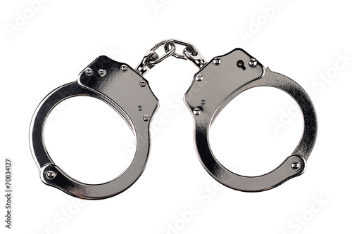 steel handcuffs isolated over white background photo