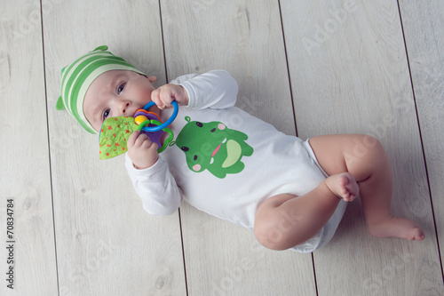 Happy baby lying on the floor