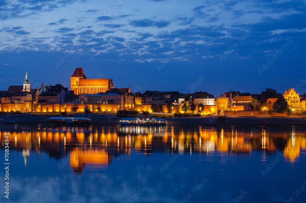 Torun (Poland) at night. The view from Vistula river