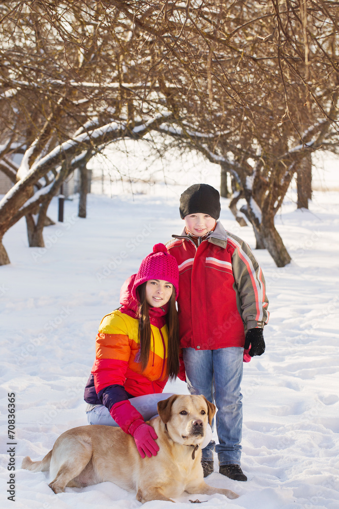 Girl and Boy in Snow Playing with Dog Girl and Boy in Snow Playing with Dog