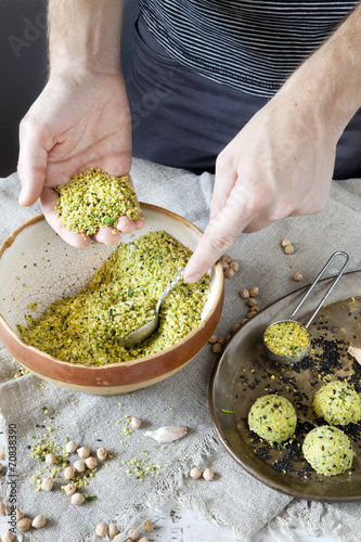 male hands preparing homemade falafel with chickpeas flour