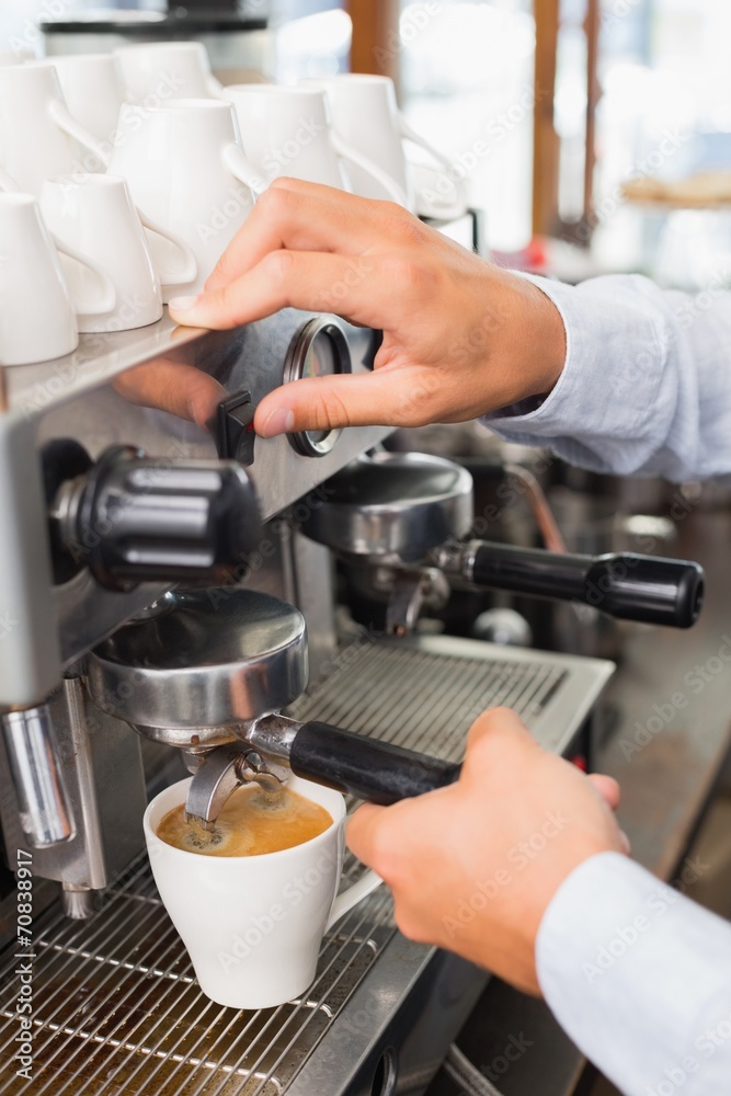Barista making a cup of coffee Barista making a cup of coffee