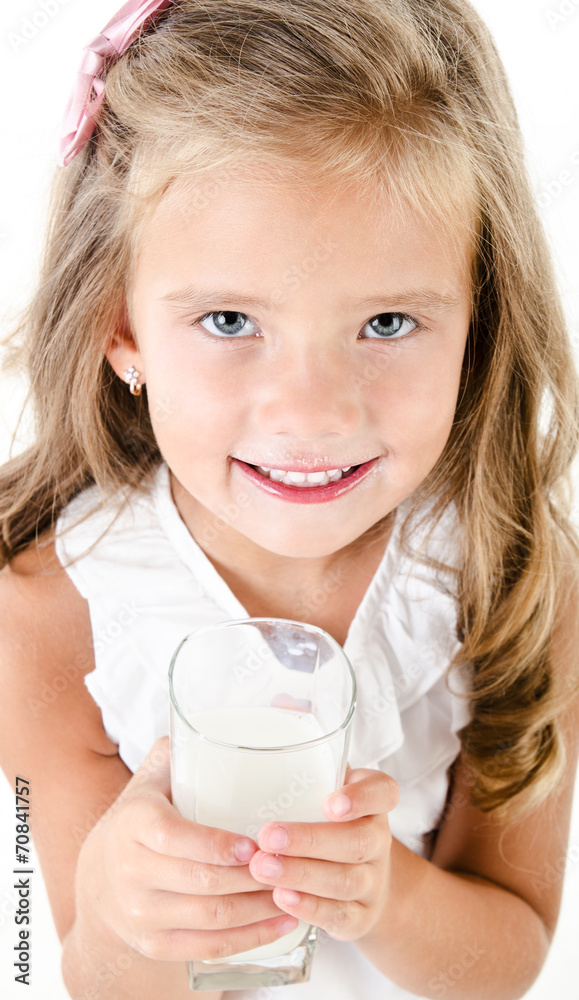 Smiling little girl drinking milk isolated Smiling little girl drinking milk isolated