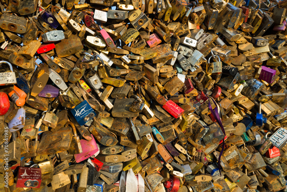 Love padlocks under sunset rays in Paris
