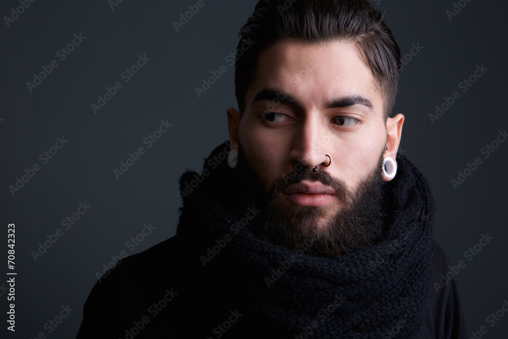 Modern young man with beard and piercings Modern young man with beard and piercings