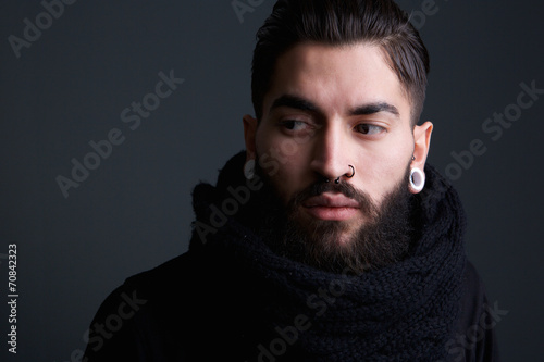 Modern young man with beard and piercings