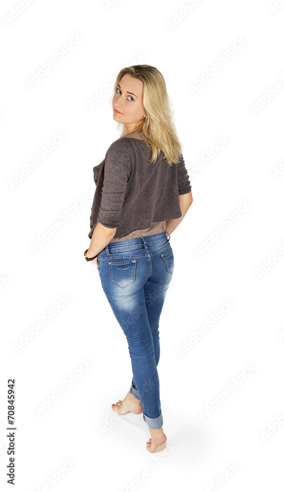 Young attractive woman in blue jeans standing from the back and Young attractive woman in blue jeans standing from the back and