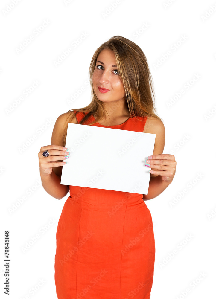 Young attractive girl in orange dress holding a white sheet of p Young attractive girl in orange dress holding a white sheet of p