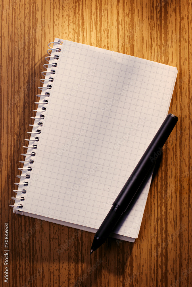 Blank notebook and pencil on a desk Blank notebook and pencil on a desk