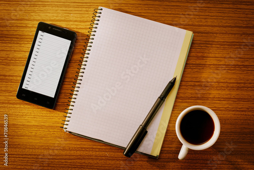 Organizer and Notebook with Cup of Coffee on Desk