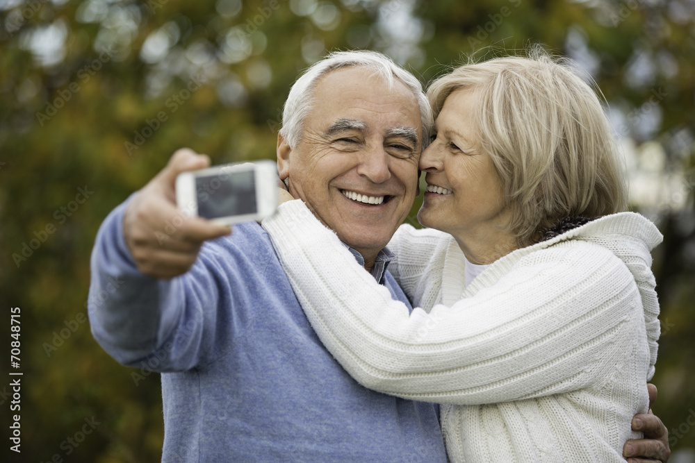 Portrait of happy senior couple taking self-portrait with smartphone Portrait of happy senior couple taking self-portrait with smartphone