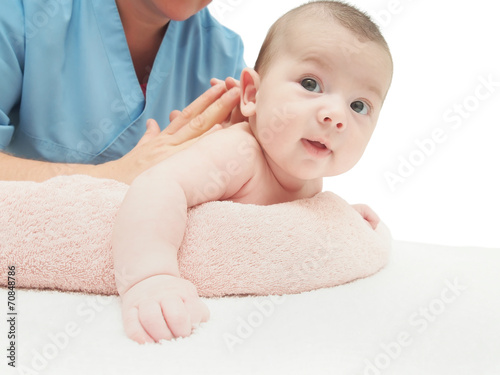 Doctor massage small caucasian baby isolated