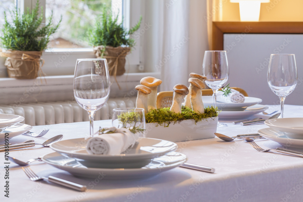 Festive laid table with decoration, partial view Festive laid table with decoration, partial view