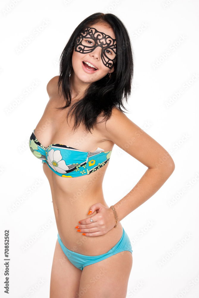 Obraz premium emotional brunette woman in swimsuit and mask