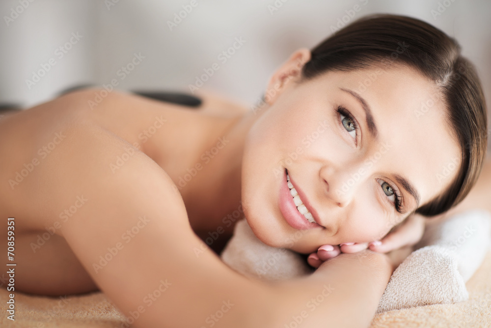 beautiful woman in spa salon with hot stones beautiful woman in spa salon with hot stones