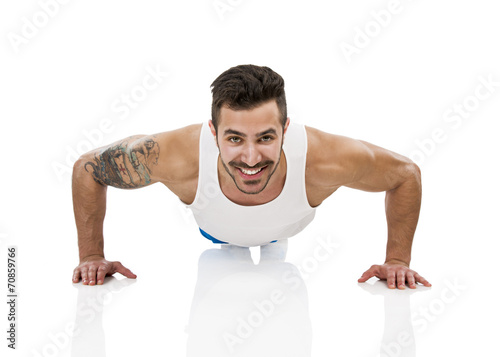 Athletic man making pushups