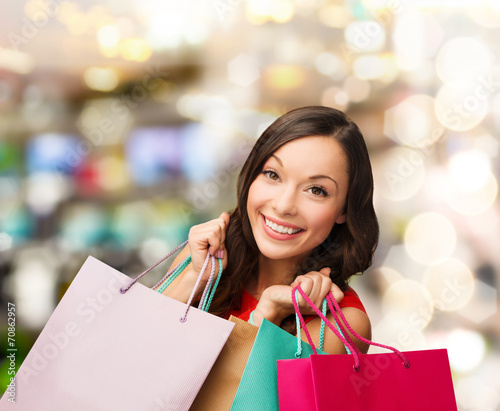 woman in red dress with shopping bags