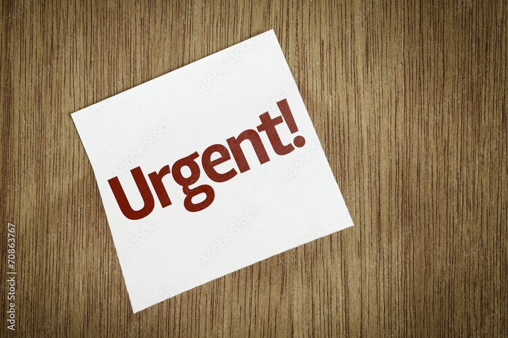 Urgent on Paper Note with texture background Urgent on Paper Note with texture background