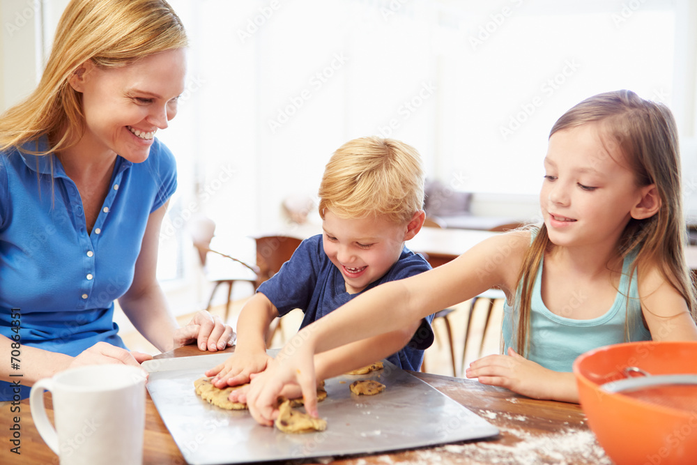 Mother And Children Baking Cookies Together At Home Mother And Children Baking Cookies Together At Home
