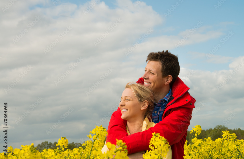 happy couple in rape field