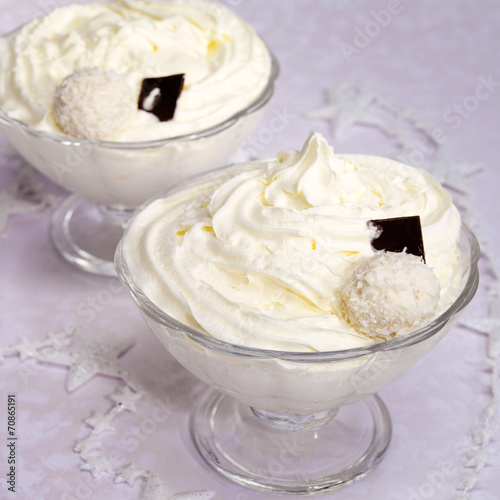 Whipped cream in a glass bowl decorated paper stars