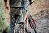 Mountainbiker dirty with mud