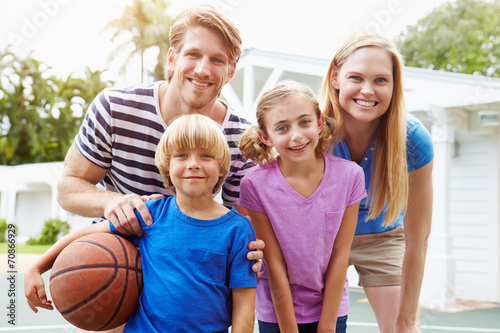 Portrait Of Family Playing Basketball Together