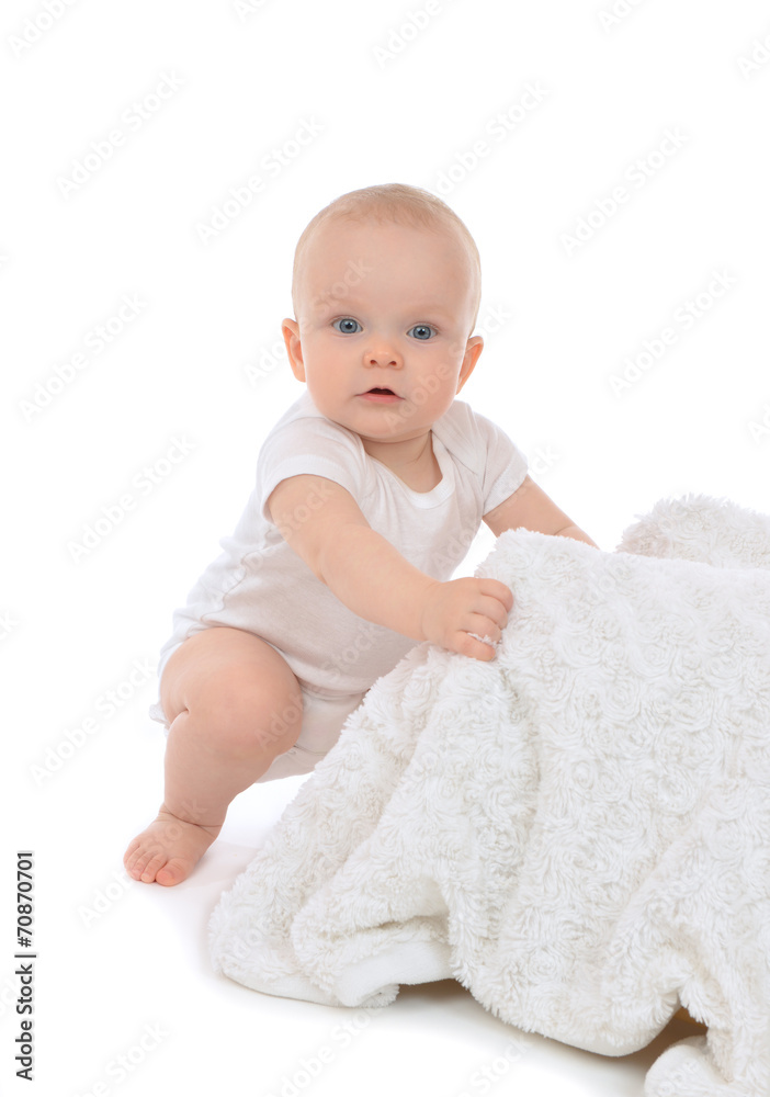 Infant child baby toddler sitting and eating soft blanket towel Infant child baby toddler sitting and eating soft blanket towel