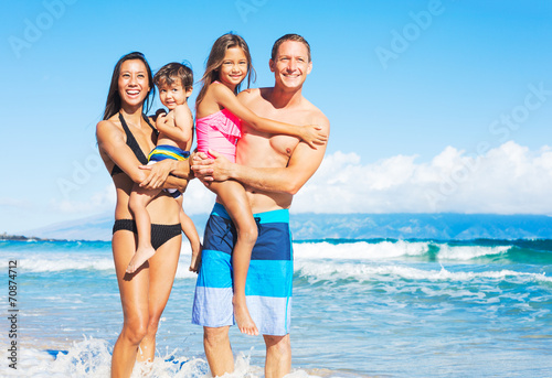 Happy Mixed Race Family on the Beach © EpicStockMedia