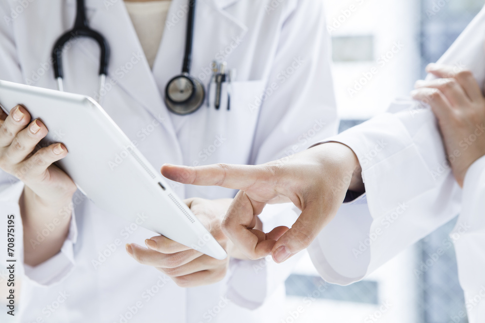 Doctor pointing at tablet Doctor pointing at tablet