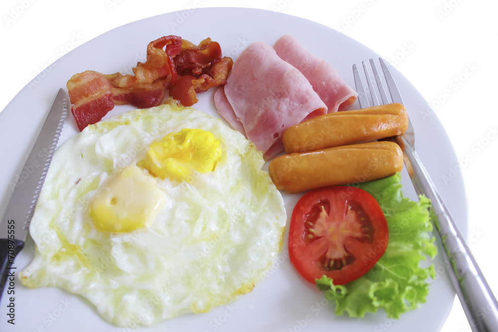 Plate of breakfast with fried eggs, bacon isolated on white back Plate of breakfast with fried eggs, bacon isolated on white back