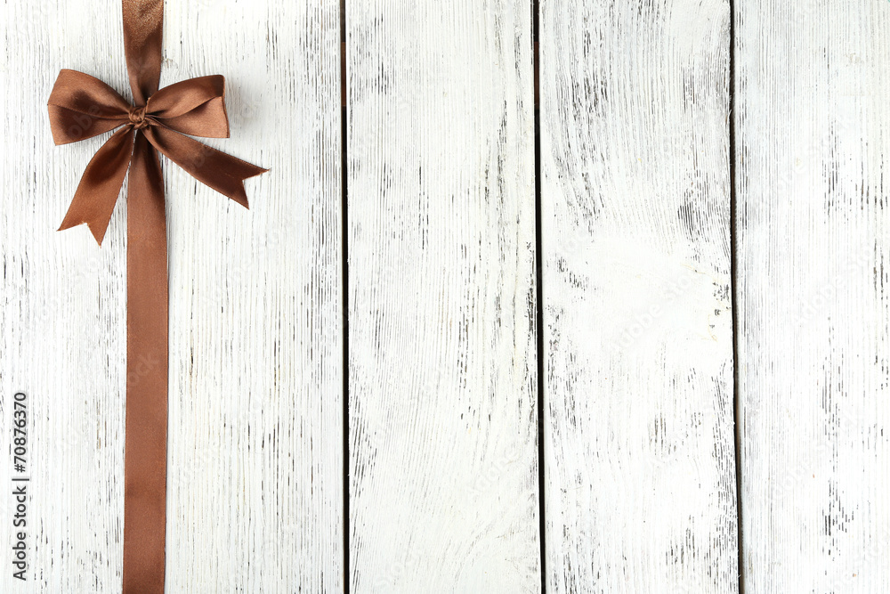 Old wooden background with beautiful bow Old wooden background with beautiful bow