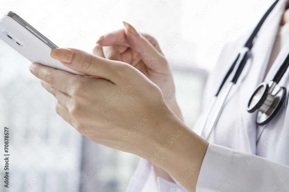 Hand of the doctor to check the mobile phone Hand of the doctor to check the mobile phone