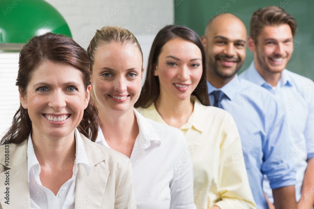 Business team standing in a row smiling at camera Business team standing in a row smiling at camera