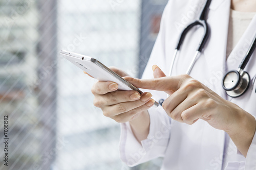 Hand of female doctor to have a cell phone