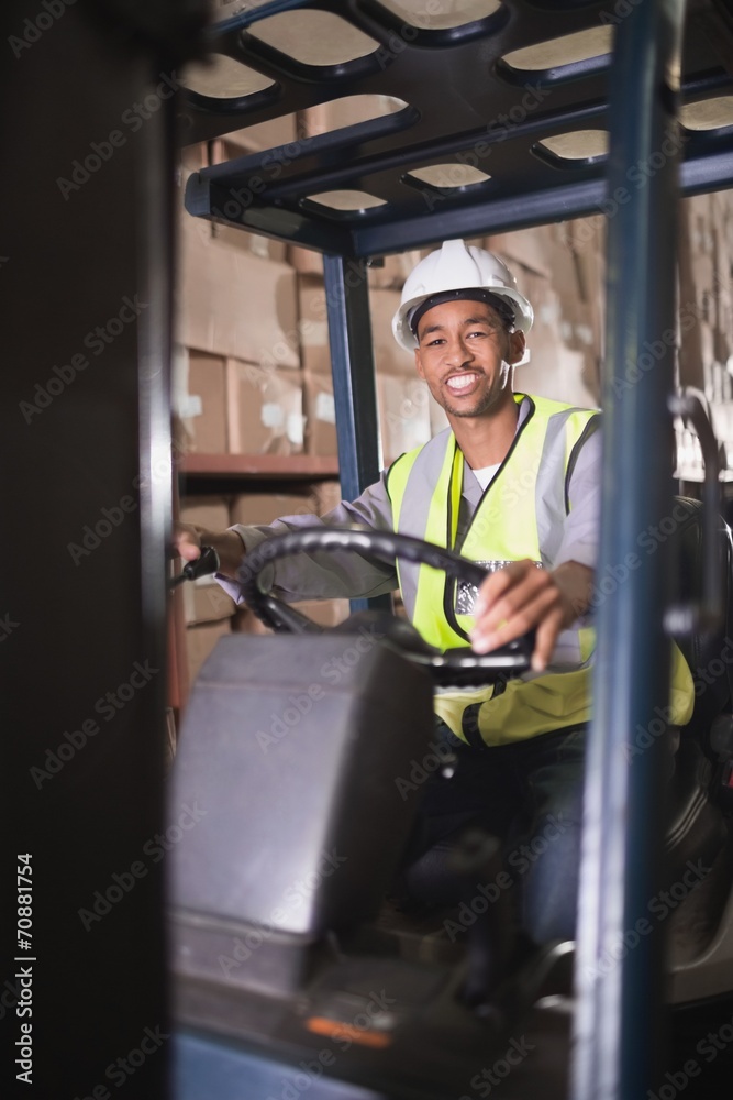 Driver operating forklift machine in warehouse Driver operating forklift machine in warehouse