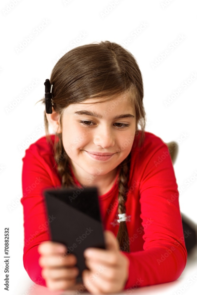 Cute little girl using smartphone Cute little girl using smartphone