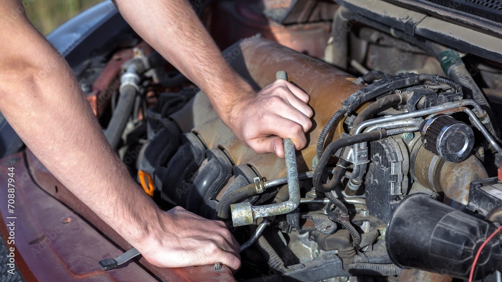 Man repairing motor block