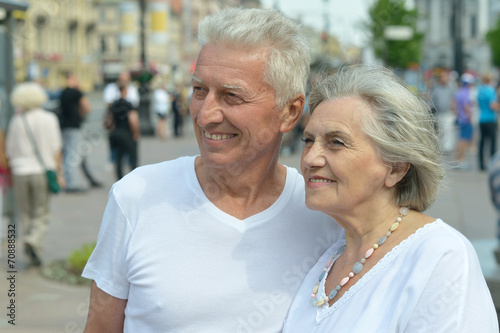 Mature couple walking in town © aletia2011