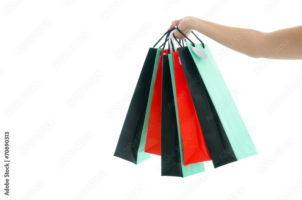 Woman hand holding shopping bag on white background