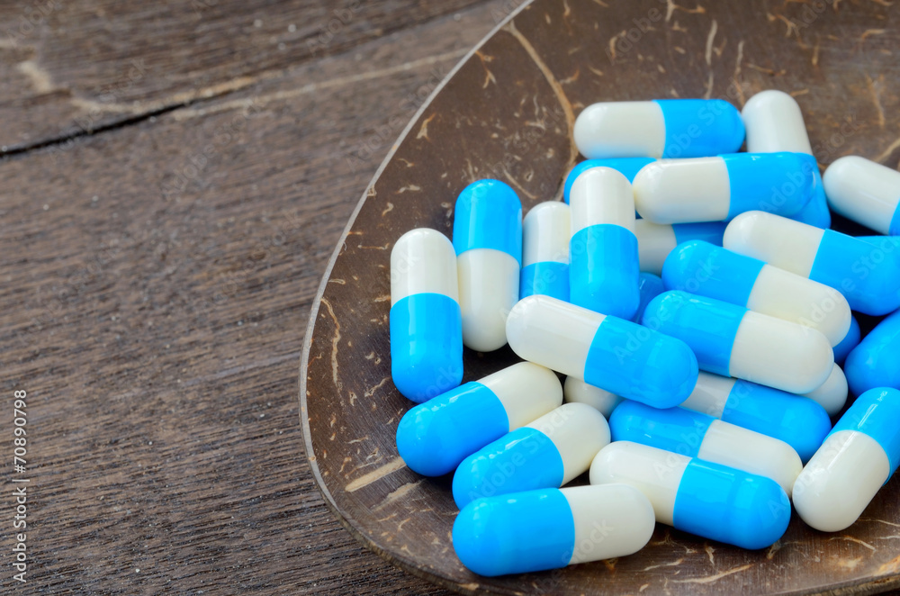 medicine capsule pill on spoon medicine capsule pill on spoon