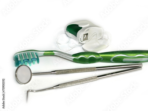Obraz na płótnie Toothbrushes, dental floss and a mirror on white w salonie