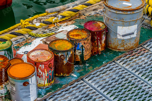 Colorful paint cans on the docks © Andrew Seymour