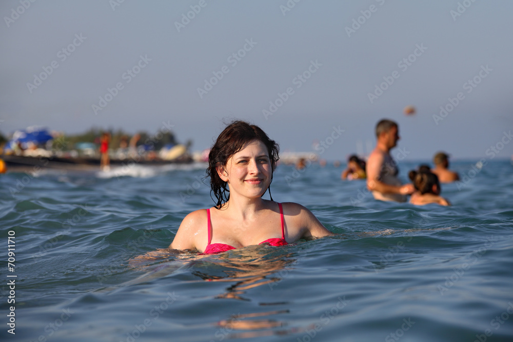 girl standing in sea water deep
