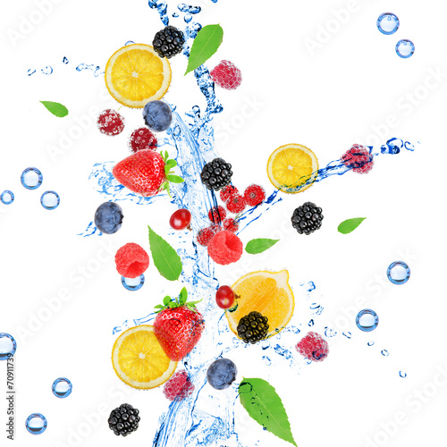 Fototapeta Naklejka Na Ścianę i Meble -  Fresh fruit, berries and green leaves with water splash,